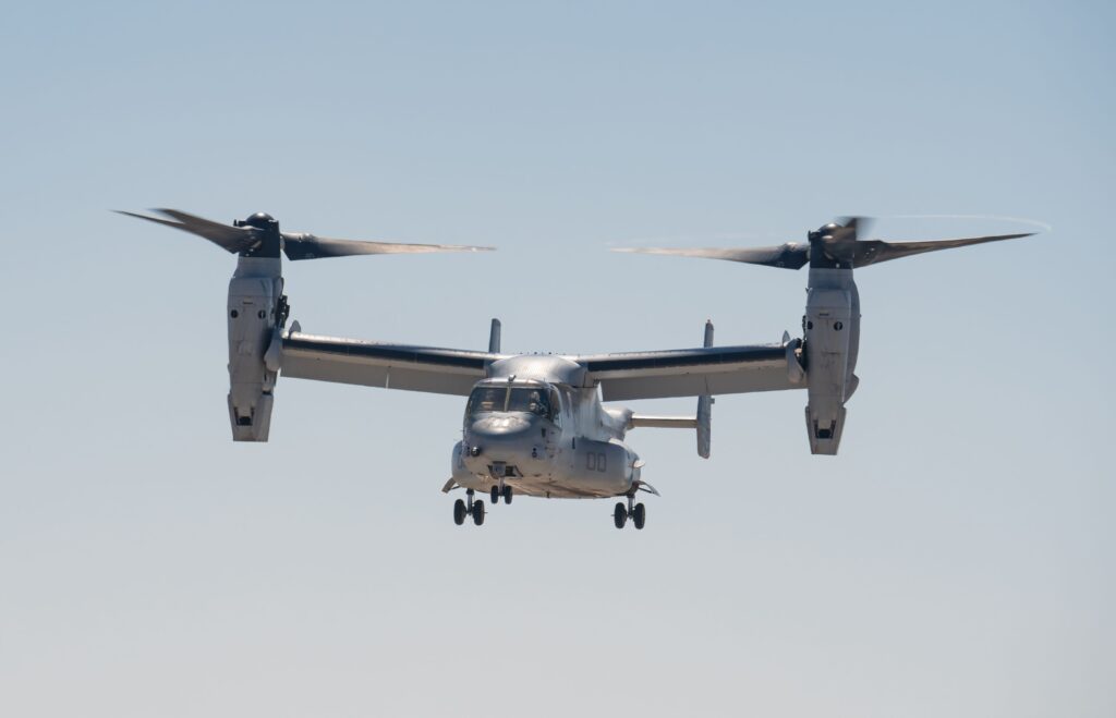 Bell Boeing V-22 Osprey aircraft flying against a clear sky in Miramar, CA.