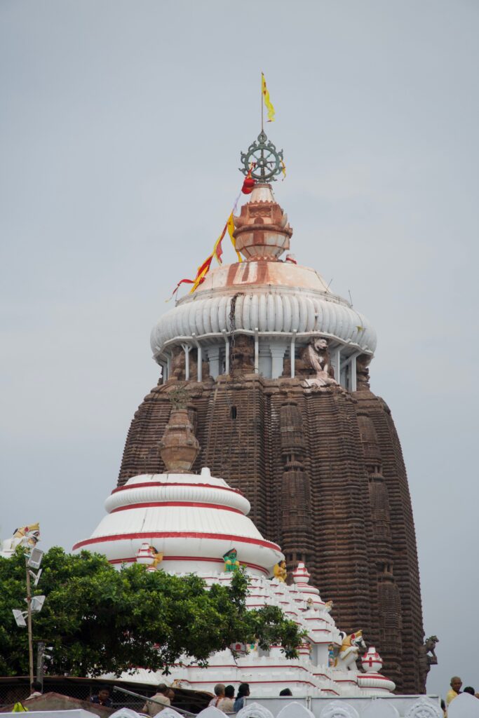 Jagannath Temple's iconic tower stands tall in Puri, showcasing intricate architecture.